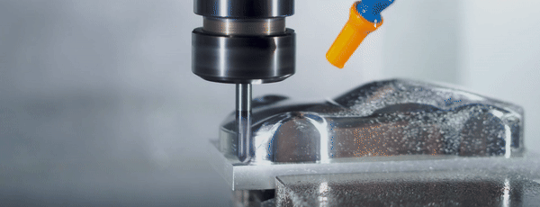 machine sculpting a tiny race car model out of steel